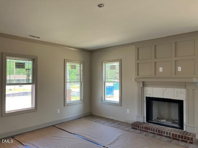 169 Big Pine Road Clayton, NC 27520 - Photo 3 of 14 a view of an empty room with window and fireplace