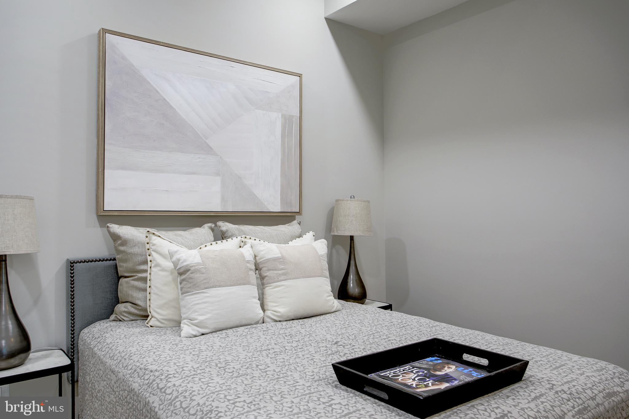 2301 Ontario Road Northwest, Unit 101 Washington, DC 20009 - Photo 15 of 24 a bedroom with a bed and a window