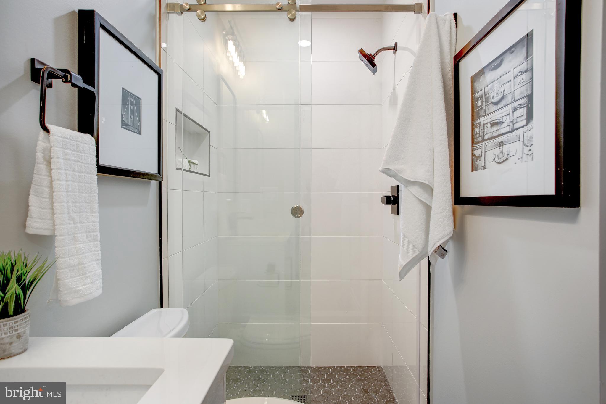 2301 Ontario Road Northwest, Unit 101 Washington, DC 20009 - Photo 21 of 24 a bathroom with a shower and a sink