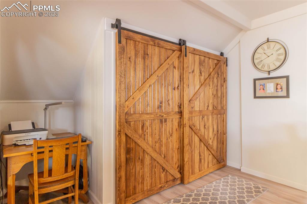 1699 Spring Valley Drive Divide, CO 80814 - Photo 13 of 43 a view of walk in closet with wooden floor