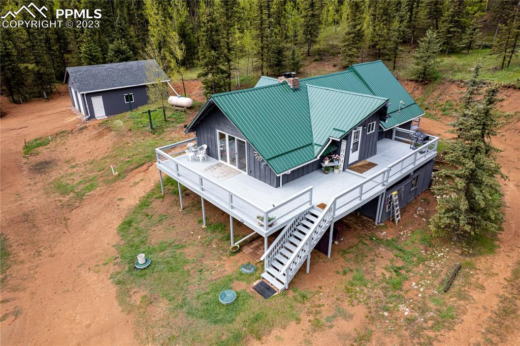 1699 Spring Valley Drive Divide, CO 80814 - Photo 2 of 43 an aerial view of a house with a yard and balcony