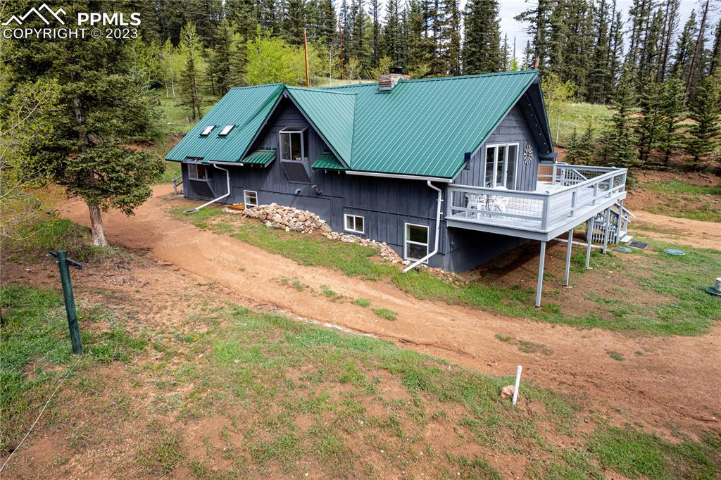 1699 Spring Valley Drive Divide, CO 80814 - Photo 3 of 43 an aerial view of a house with swimming pool and sitting area