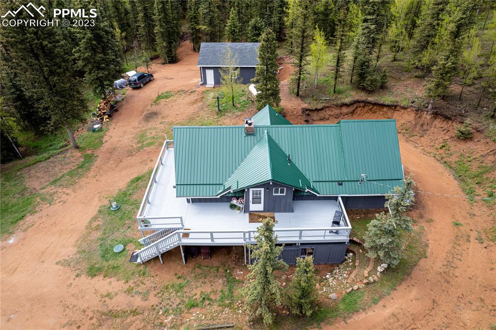 1699 Spring Valley Drive Divide, CO 80814 - Photo 42 of 43 an aerial view of a house with garden space and sitting area