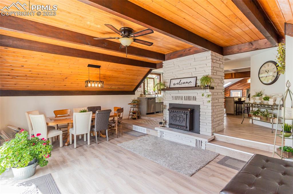 1699 Spring Valley Drive Divide, CO 80814 - Photo 8 of 43 a view of a fireplace with a table and chairs