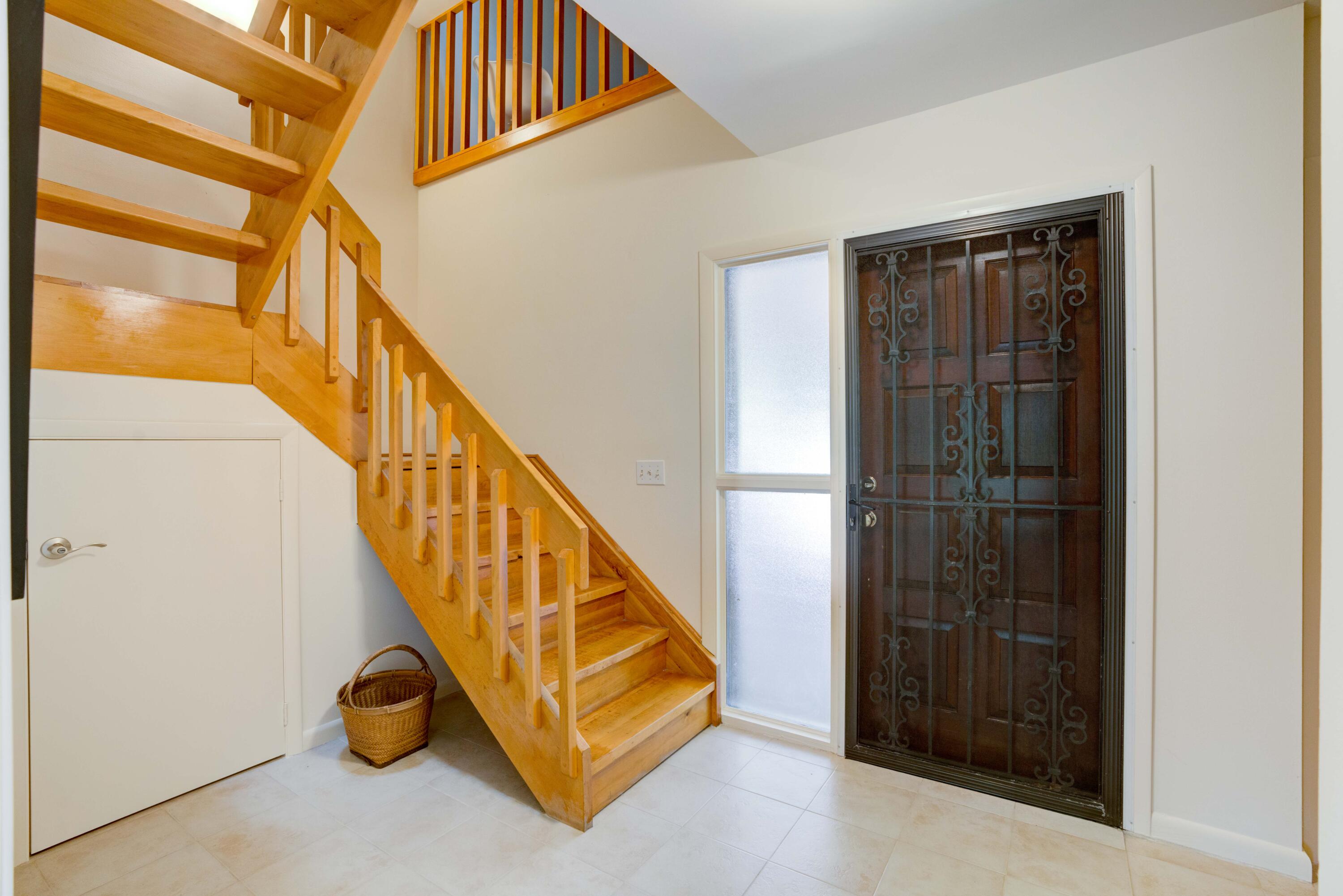 170 Celestial Way, Unit 32 Juno Beach, FL 33408 - Photo 11 of 30 a view of stairs and hall with wooden floor
