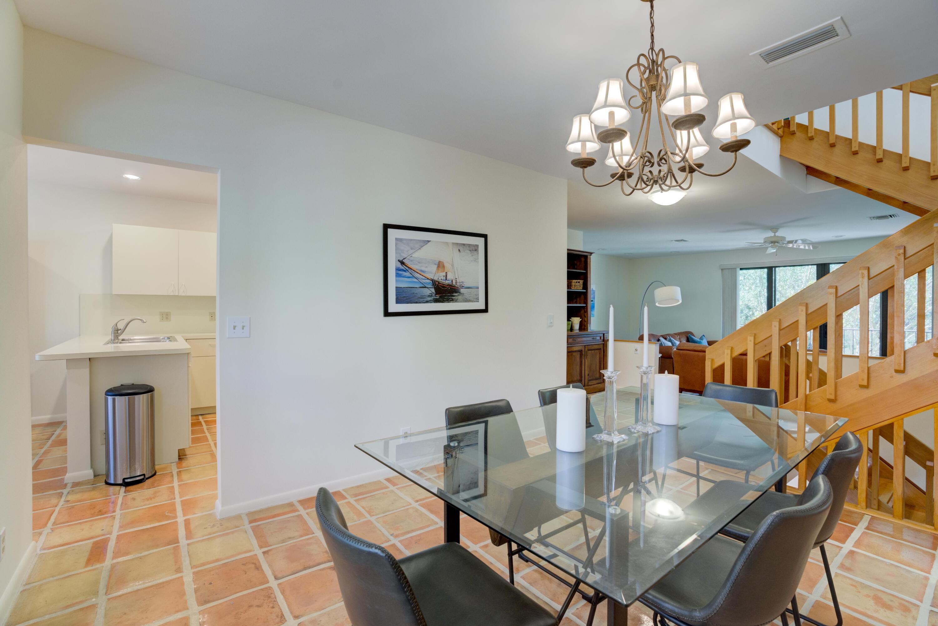 170 Celestial Way, Unit 32 Juno Beach, FL 33408 - Photo 14 of 30 a view of a dining room with furniture