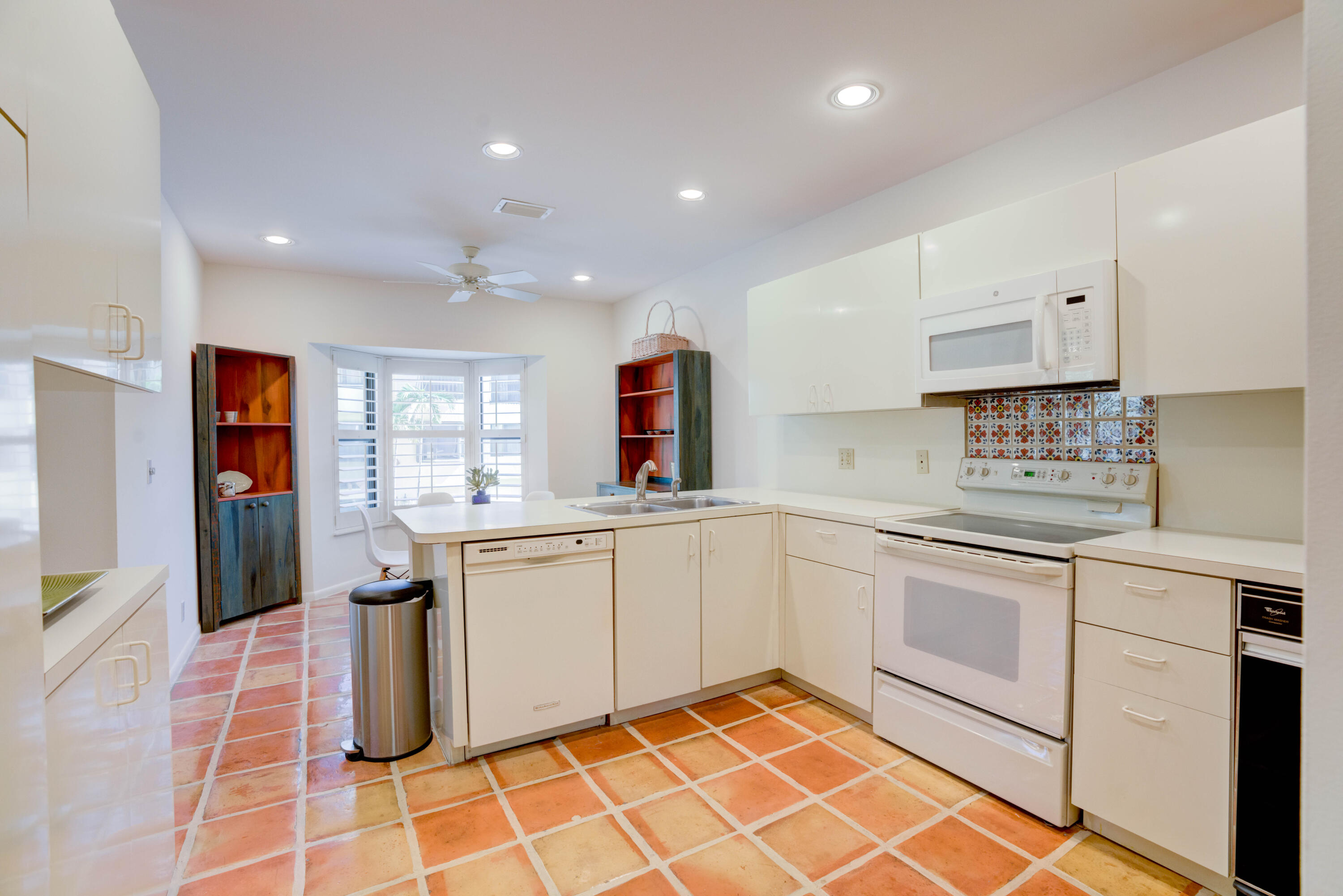 170 Celestial Way, Unit 32 Juno Beach, FL 33408 - Photo 16 of 30 a kitchen with a sink cabinets and window