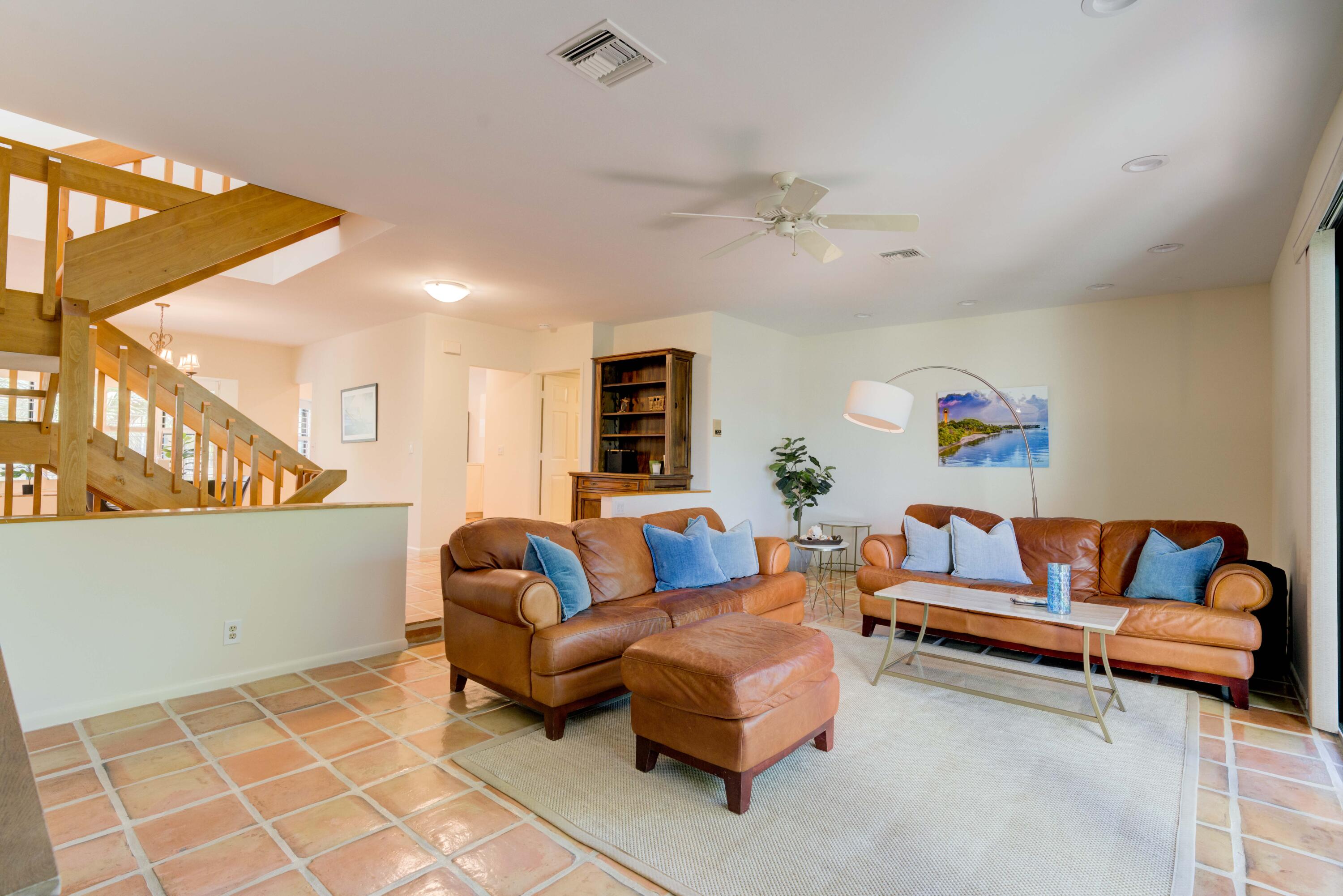 170 Celestial Way, Unit 32 Juno Beach, FL 33408 - Photo 20 of 30 a living room with furniture and a rug