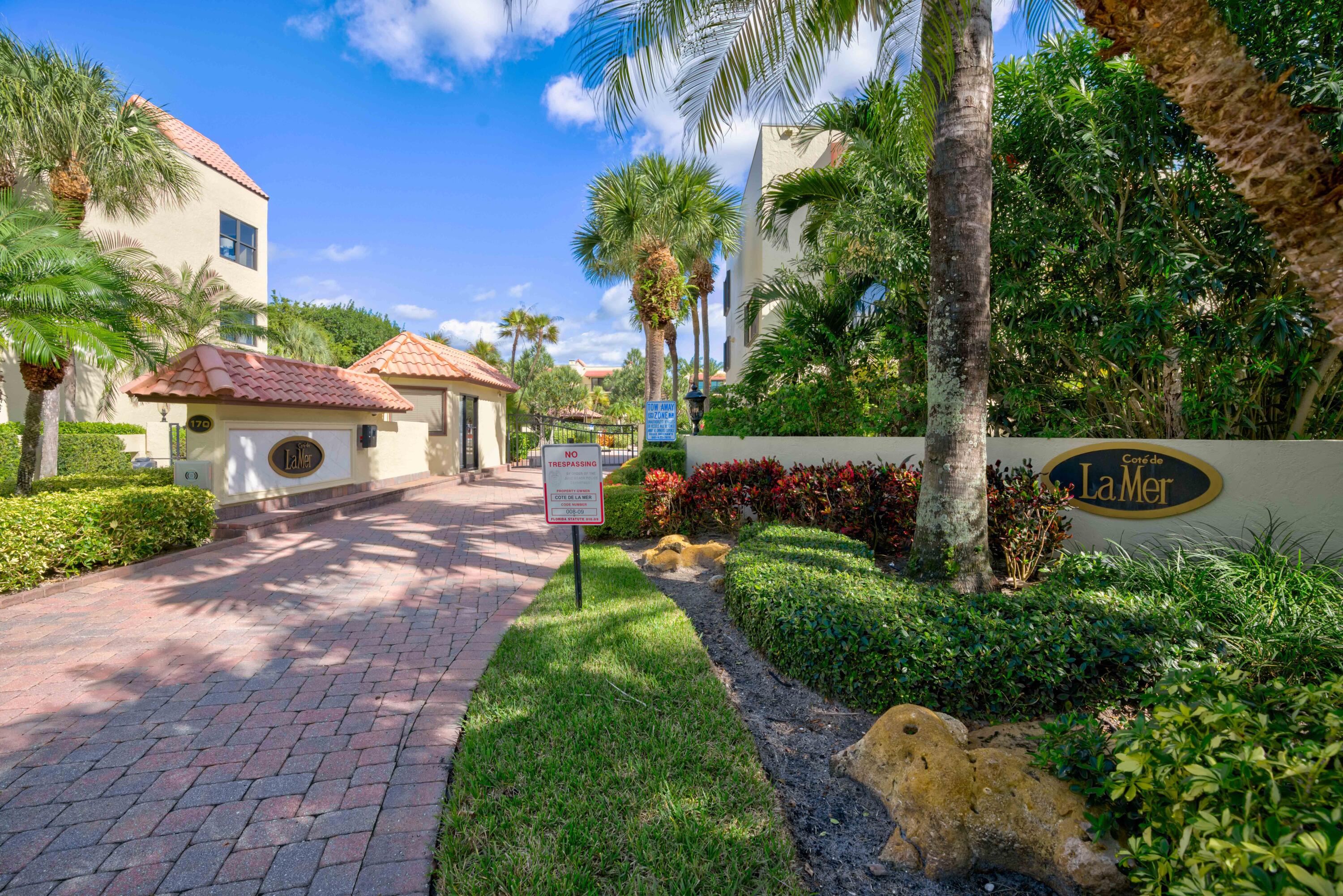 170 Celestial Way, Unit 32 Juno Beach, FL 33408 - Photo 2 of 30 a front view of a house with a yard
