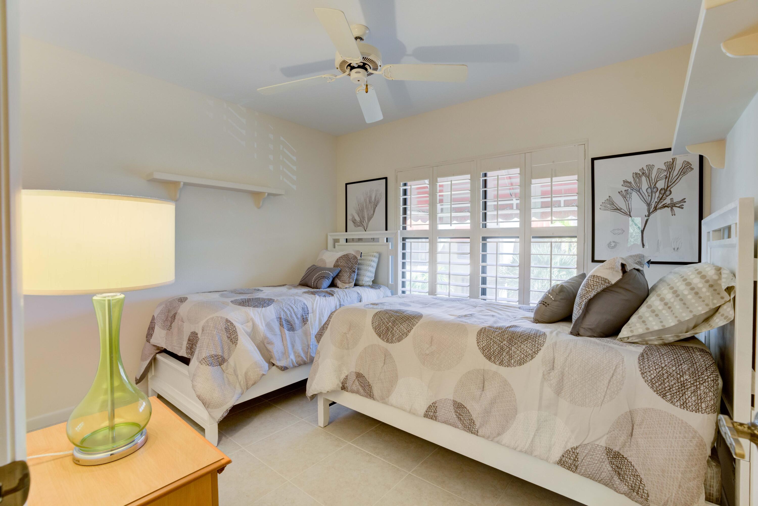 170 Celestial Way, Unit 32 Juno Beach, FL 33408 - Photo 25 of 30 a bedroom with a bed and window