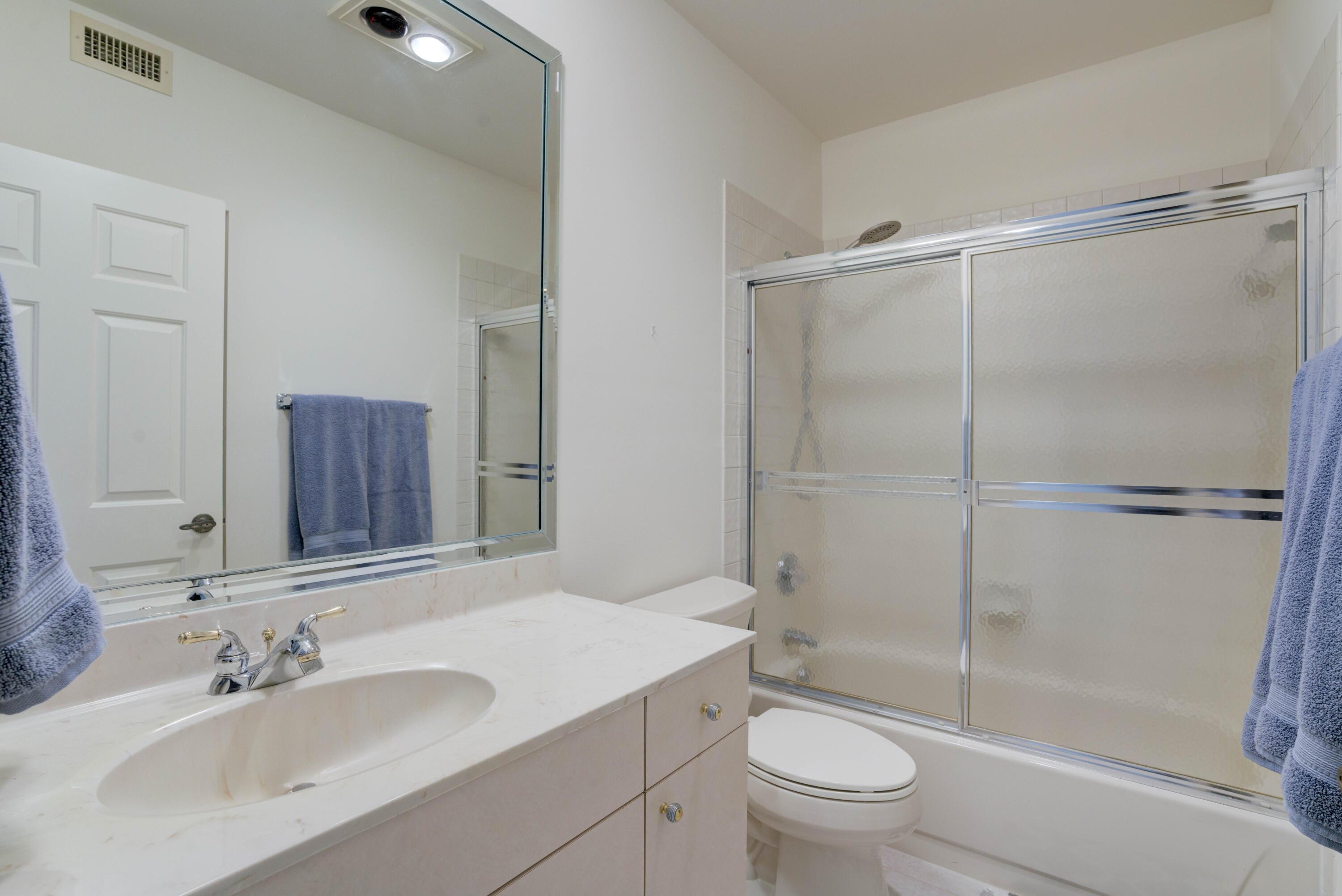 170 Celestial Way, Unit 32 Juno Beach, FL 33408 - Photo 27 of 30 a bathroom with a sink toilet and shower