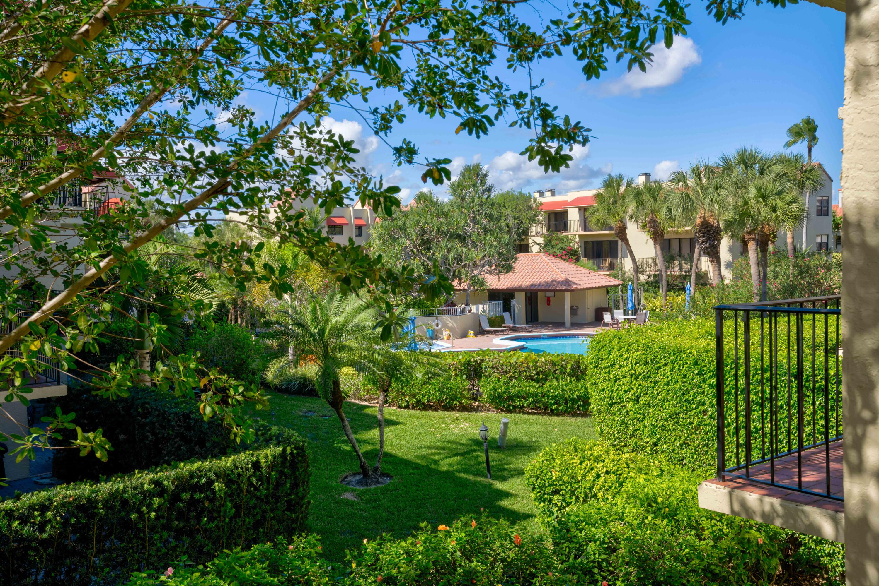 170 Celestial Way, Unit 32 Juno Beach, FL 33408 - Photo 28 of 30 a view of a garden