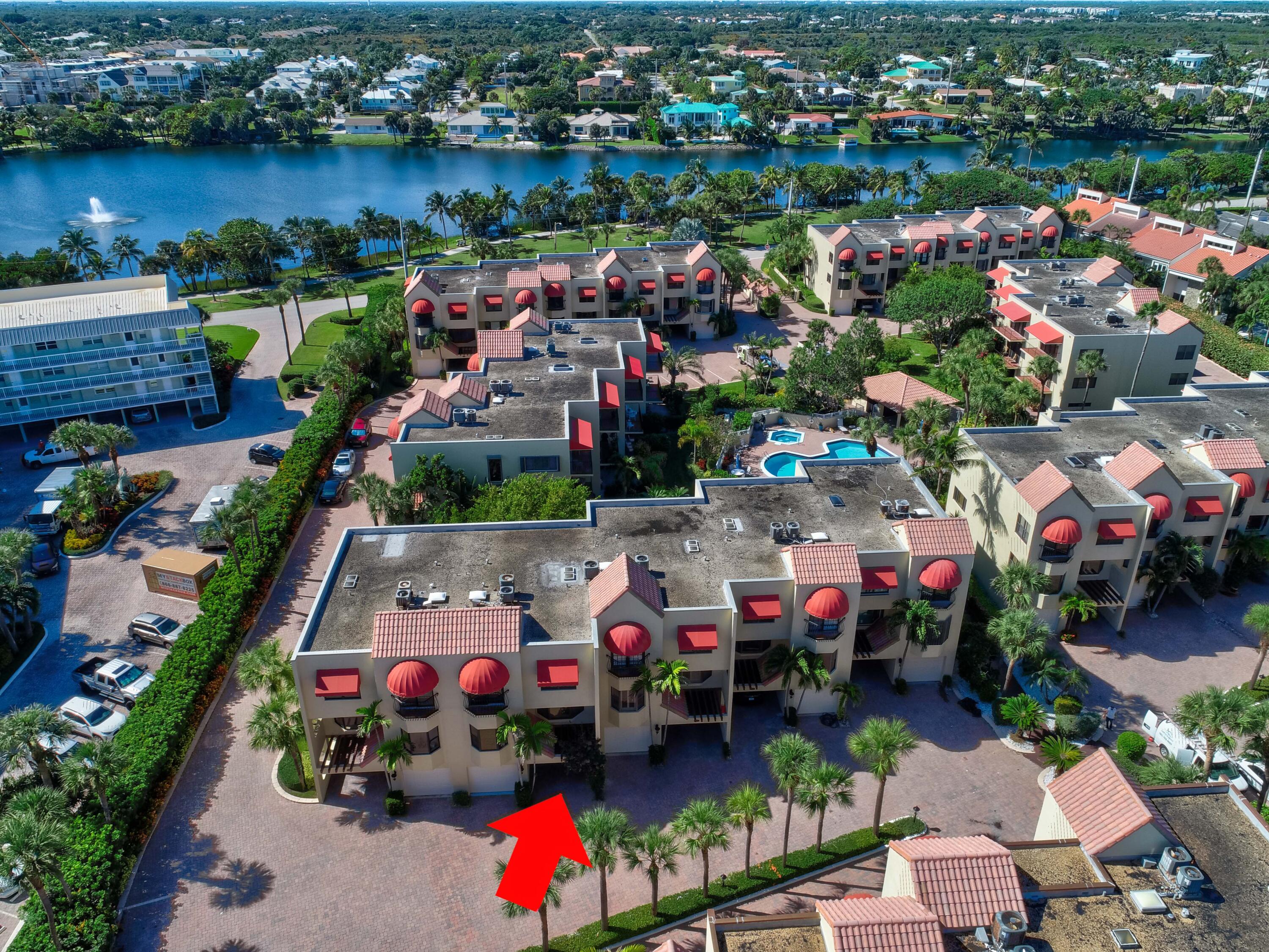 170 Celestial Way, Unit 32 Juno Beach, FL 33408 - Photo 5 of 30 an aerial view of a city with lots of residential buildings ocean and mountain view in back