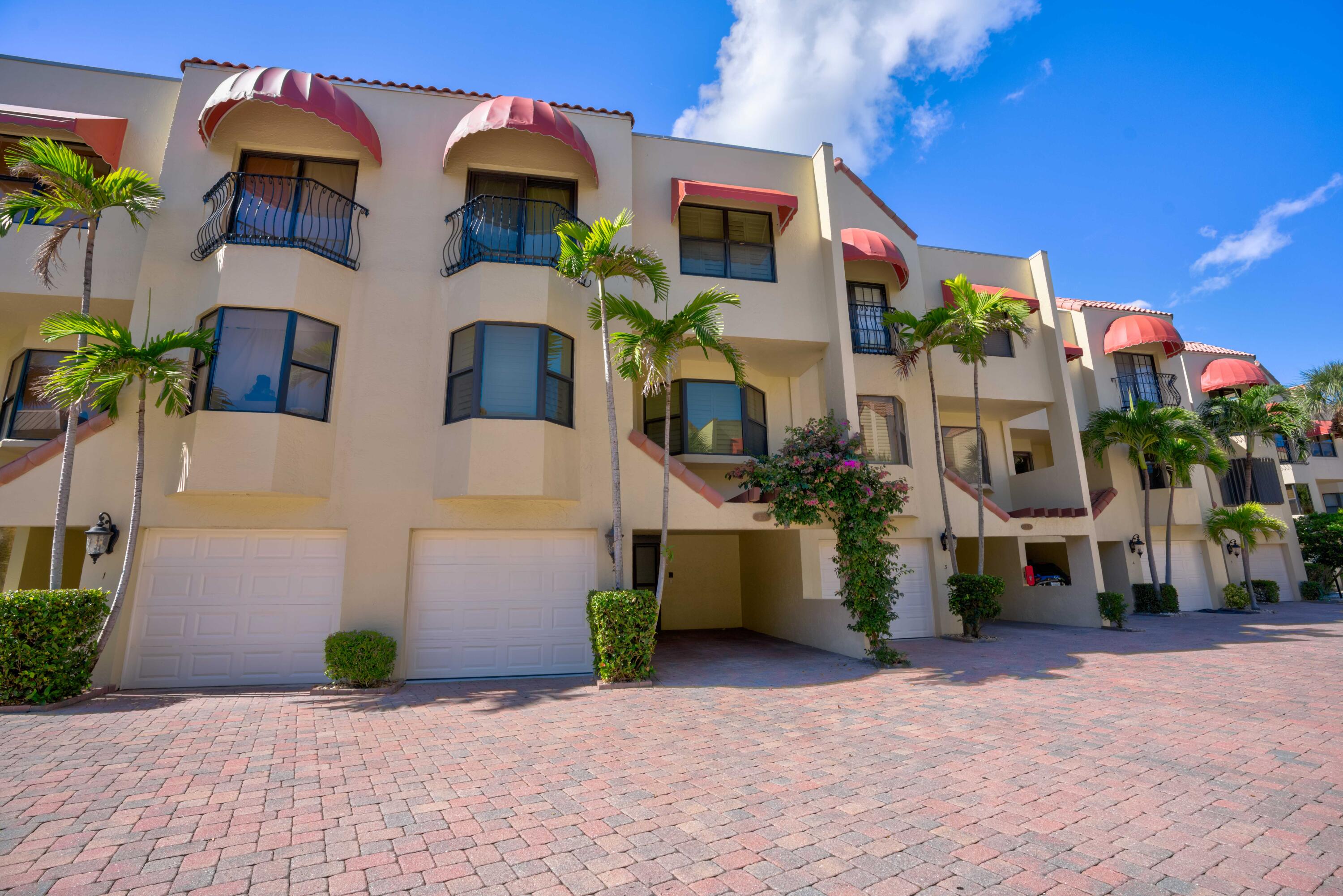 170 Celestial Way, Unit 32 Juno Beach, FL 33408 - Photo 6 of 30 a front view of a house with a yard