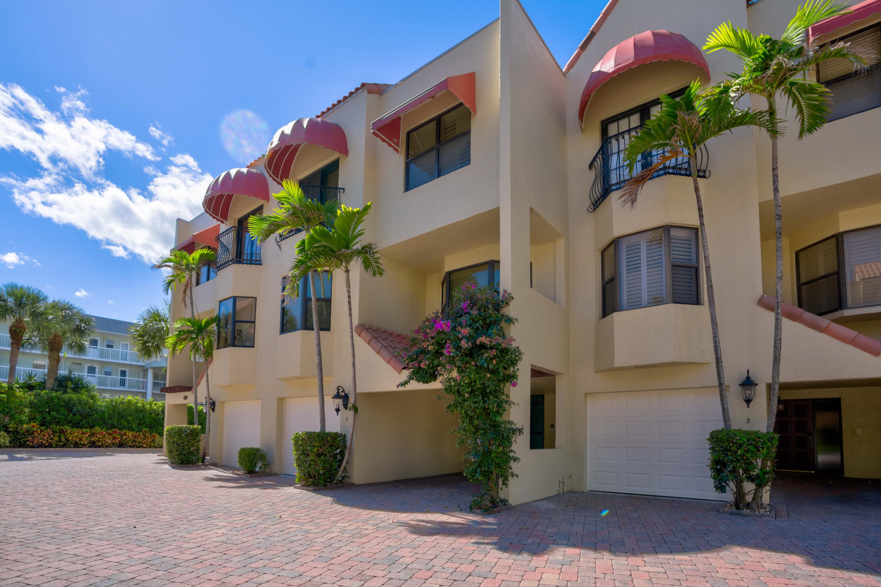 170 Celestial Way, Unit 32 Juno Beach, FL 33408 - Photo 7 of 30 a front view of a house with a yard