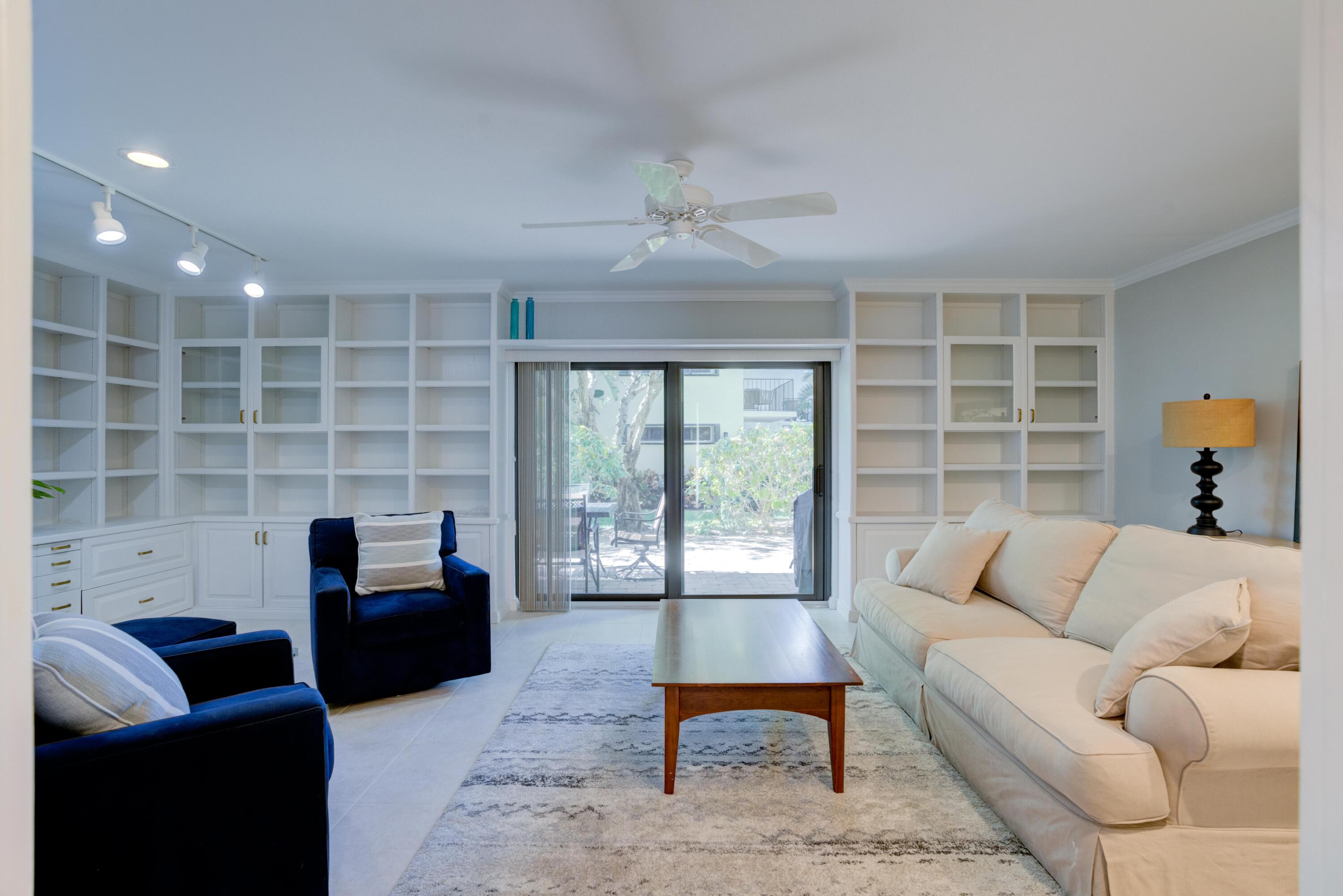 170 Celestial Way, Unit 32 Juno Beach, FL 33408 - Photo 9 of 30 a living room with furniture and a window