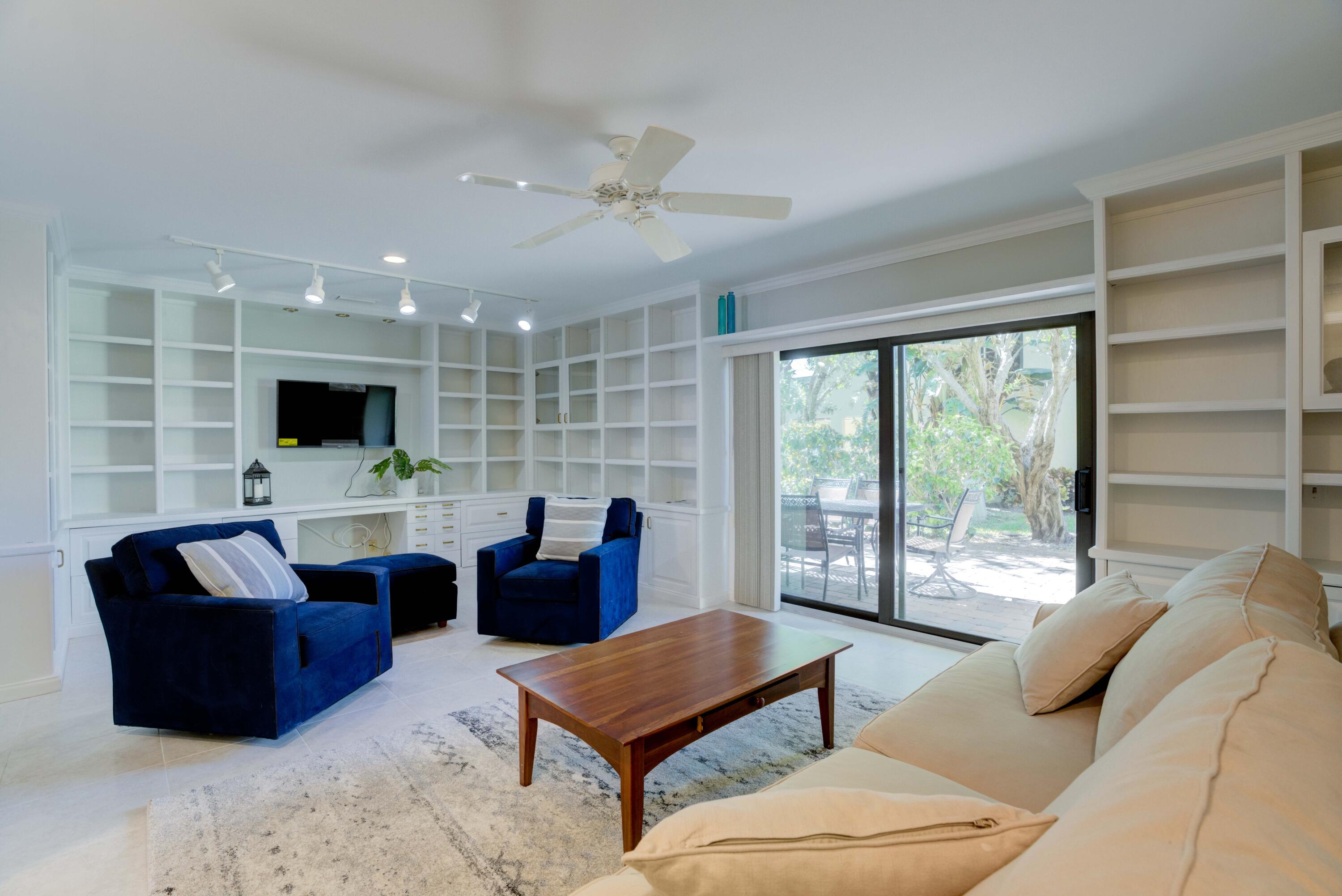 170 Celestial Way, Unit 32 Juno Beach, FL 33408 - Photo 10 of 30 a living room with furniture and a flat screen tv