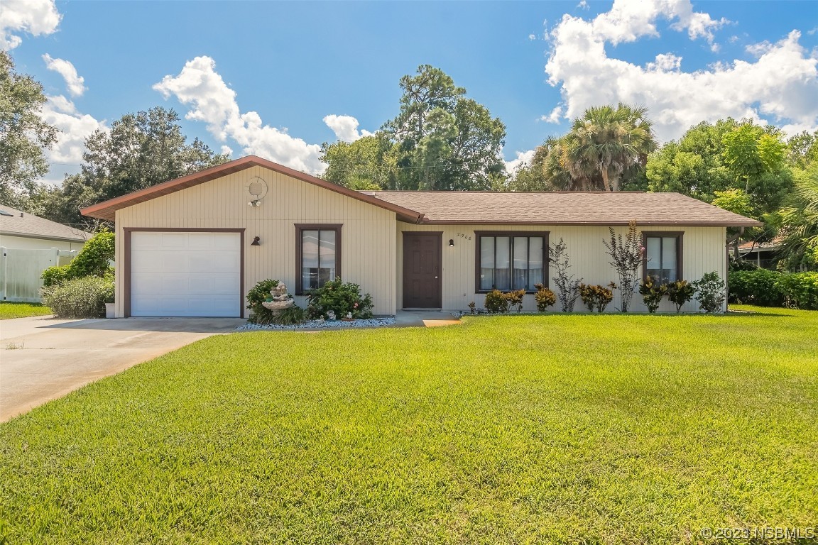 2908 Orange Tree Drive Edgewater, FL 32141 - Photo 1 of 30 a front view of a house with yard