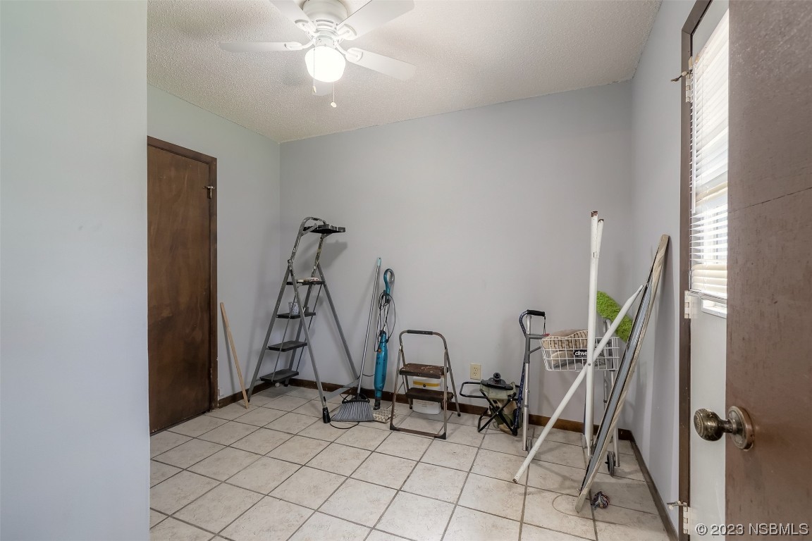 2908 Orange Tree Drive Edgewater, FL 32141 - Photo 17 of 30 a view of a room with gym equipment