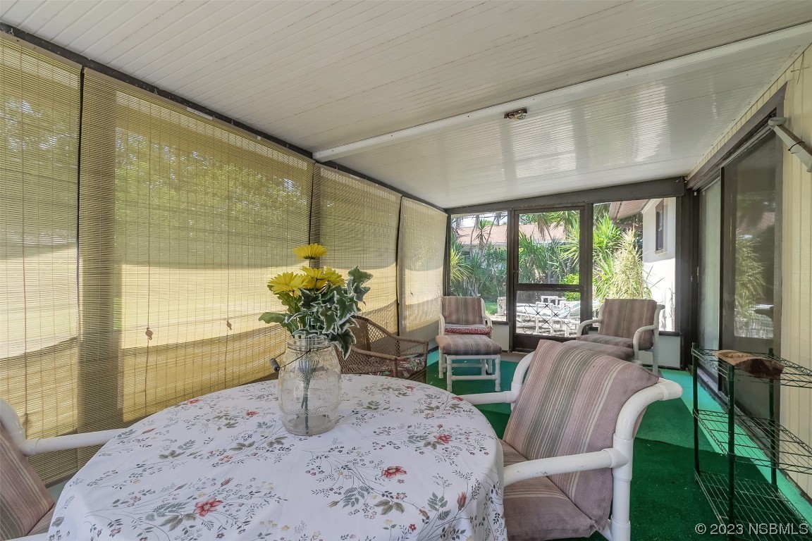 2908 Orange Tree Drive Edgewater, FL 32141 - Photo 20 of 30 a view of a dining room with furniture window and outside view