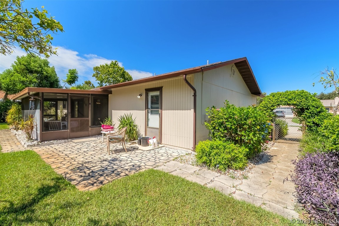 2908 Orange Tree Drive Edgewater, FL 32141 - Photo 25 of 30 a view of a house with backyard and sitting area