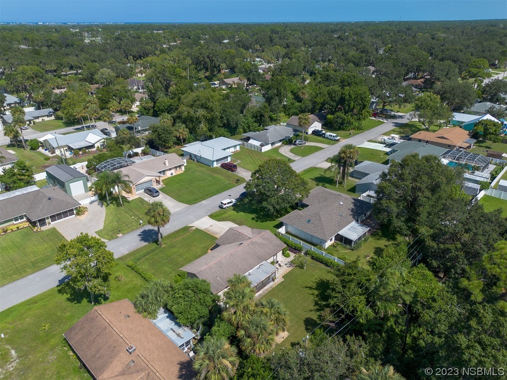 2908 Orange Tree Drive Edgewater, FL 32141 - Photo 30 of 30 an aerial view of residential houses with outdoor space and street view