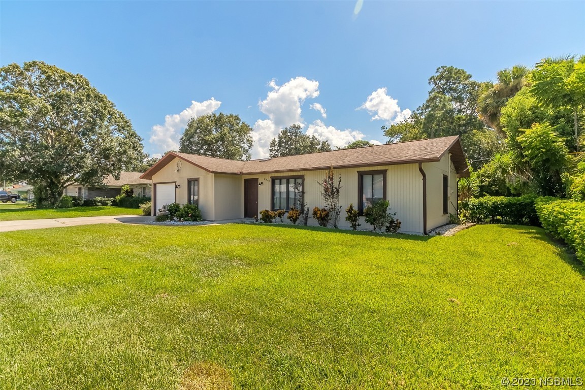 2908 Orange Tree Drive Edgewater, FL 32141 - Photo 3 of 30 a view of a house with backyard and garden