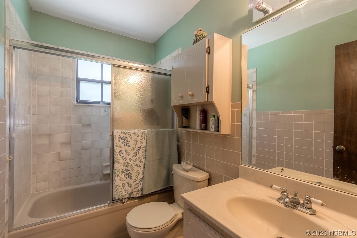 2908 Orange Tree Drive Edgewater, FL 32141 - Photo 6 of 30 a bathroom with a sink toilet and shower