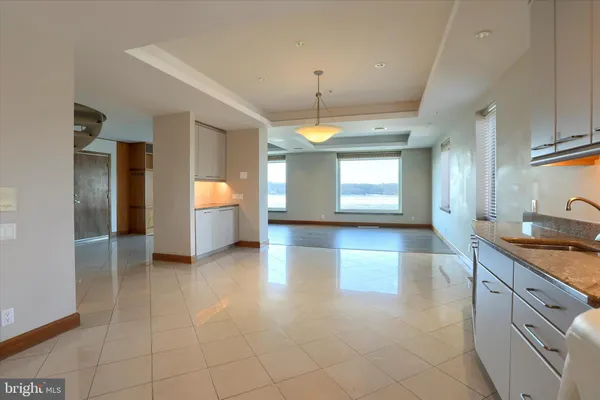 a view of a kitchen with a sink and a window