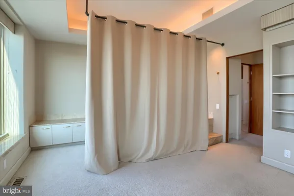 a view of a bathroom with tub and shower