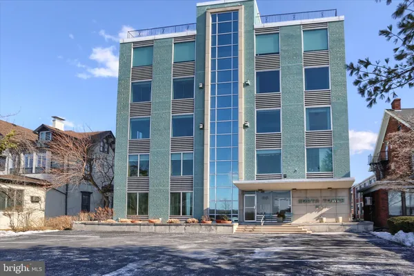 a view of a building with a street