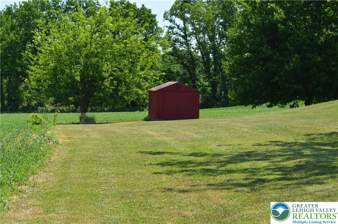 1819 Blue Barn Road Orefield, PA 18069 - Photo 3 of 21 A tranquil landscape offers vast green spaces and a practical storage shed.