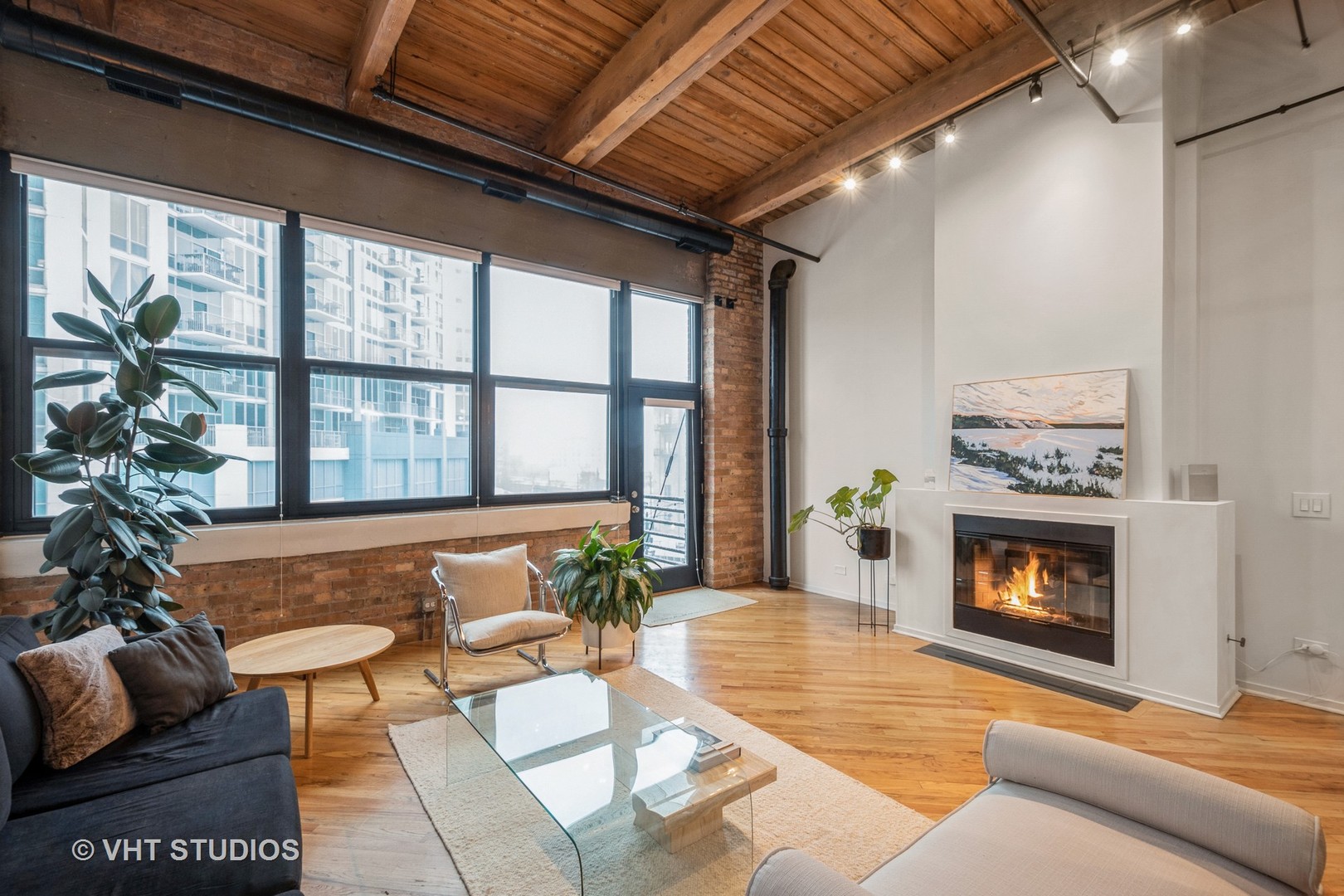 1601 South Indiana Avenue, Unit 407 Chicago, IL 60616 - Photo 4 of 16 a living room with furniture and a fireplace