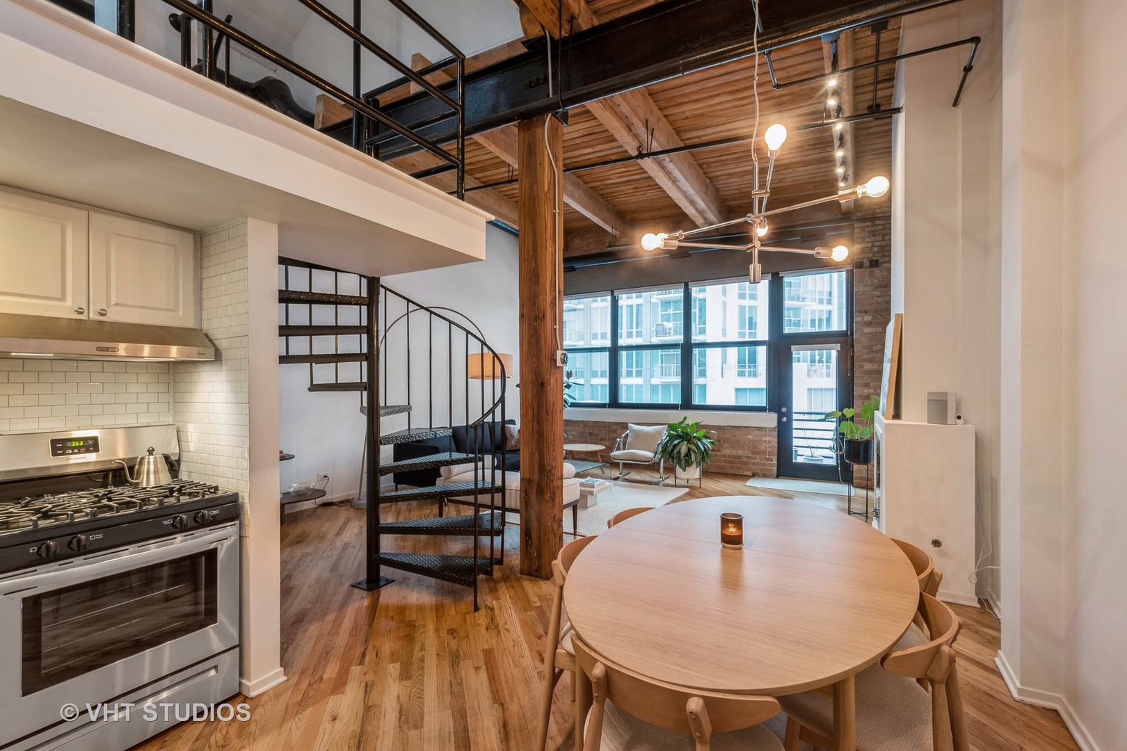1601 South Indiana Avenue, Unit 407 Chicago, IL 60616 - Photo 6 of 16 a kitchen with sink a stove and a refrigerator with wooden floor
