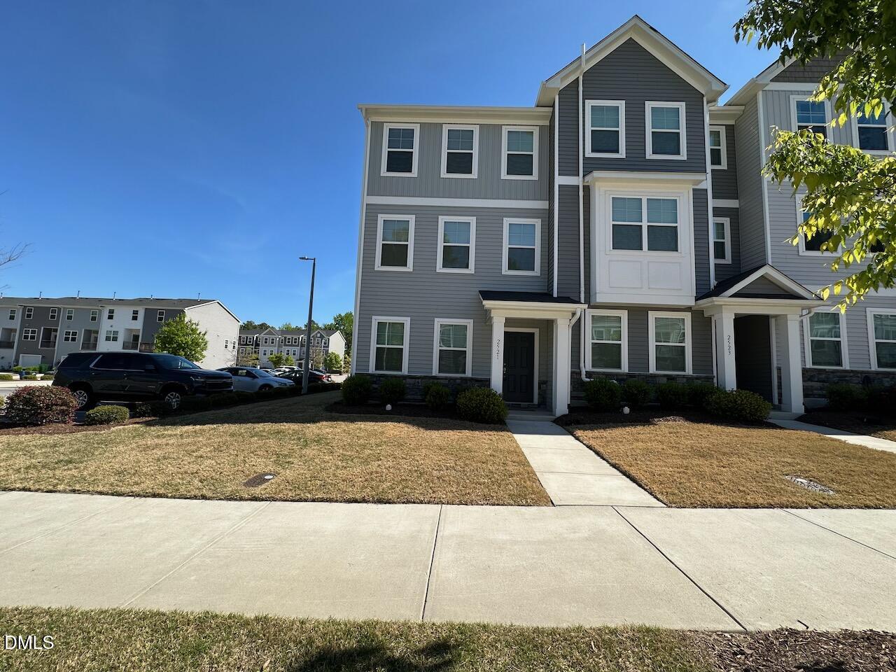 a view of multiple house with a yard