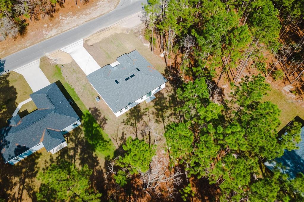 6732 Southwest 132nd Street Ocala, FL 34473 - Photo 34 of 36 an aerial view of a house with a yard and garden space