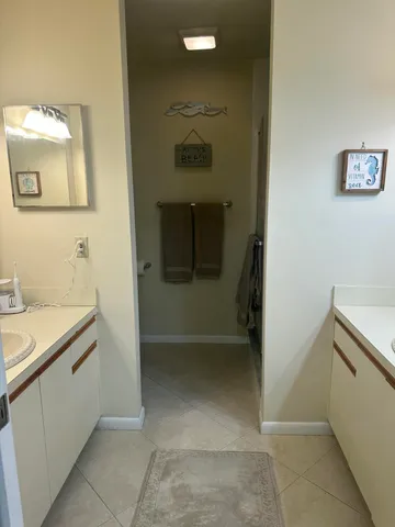 a bathroom with a sink and mirror