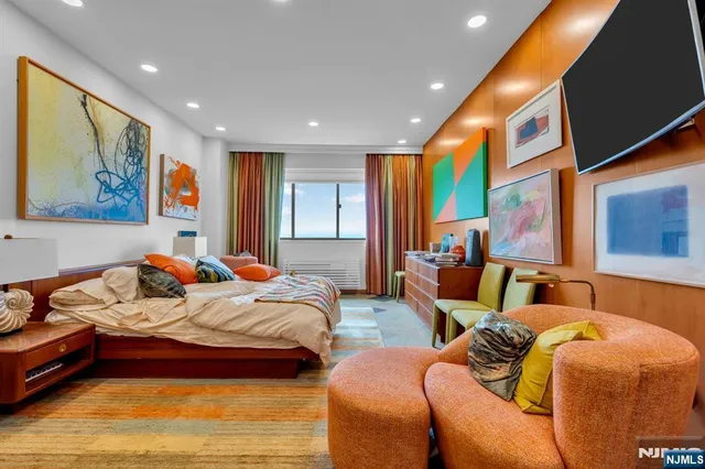 a bedroom with furniture and window