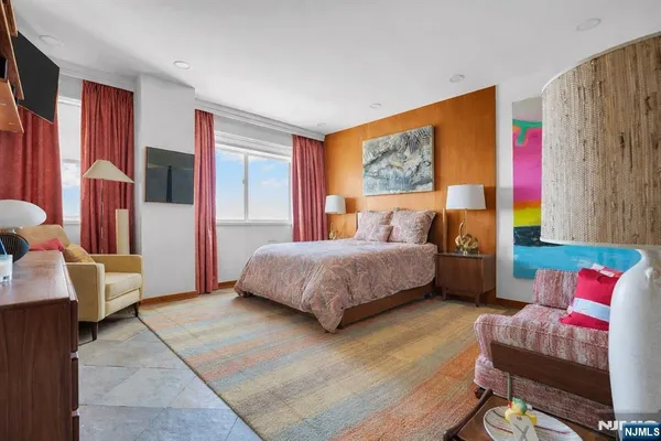 a living room with furniture and a rug