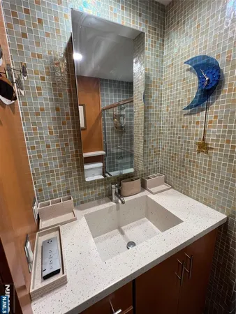 a picture of a bathroom with a sink