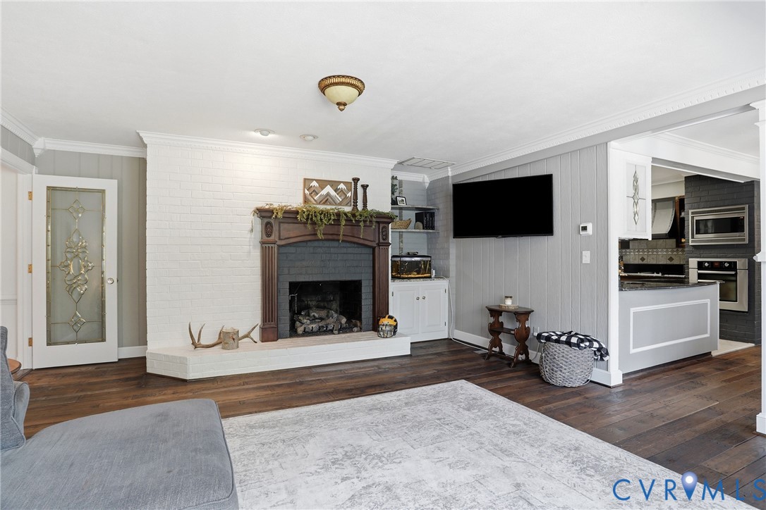 13300 West Patrick Henry Road Doswell, VA 23047 - Photo 18 of 69 Living area featuring a white brick fireplace with