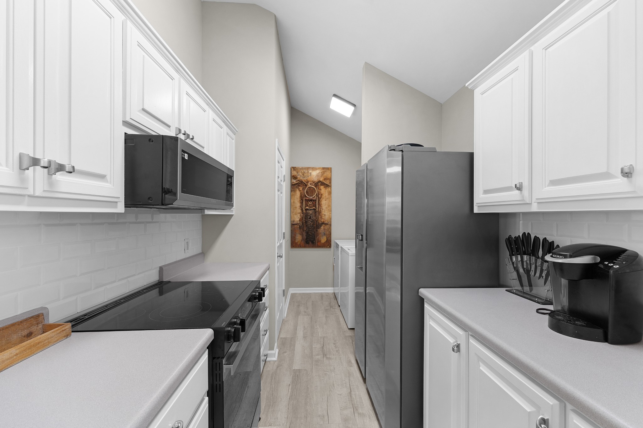 958 Pevahouse Camp Lane Decaturville, TN 38329 - Photo 15 of 32 a kitchen with a refrigerator and a sink