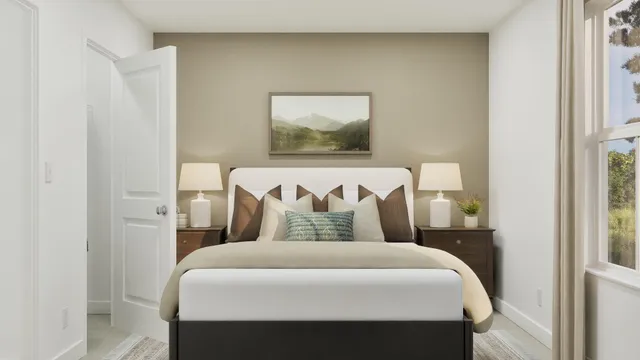 a bedroom with a bed and a painting on the wall