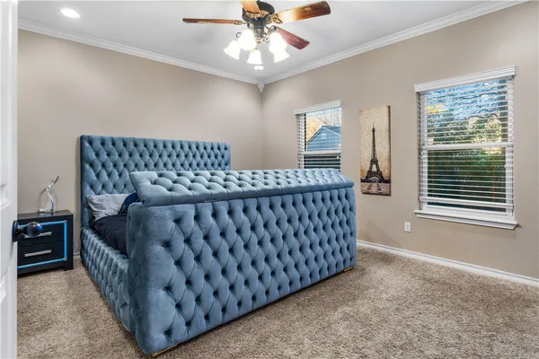 a bedroom with a bed and window