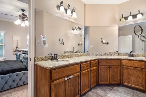 a en suite bathroom with a sink and a mirror