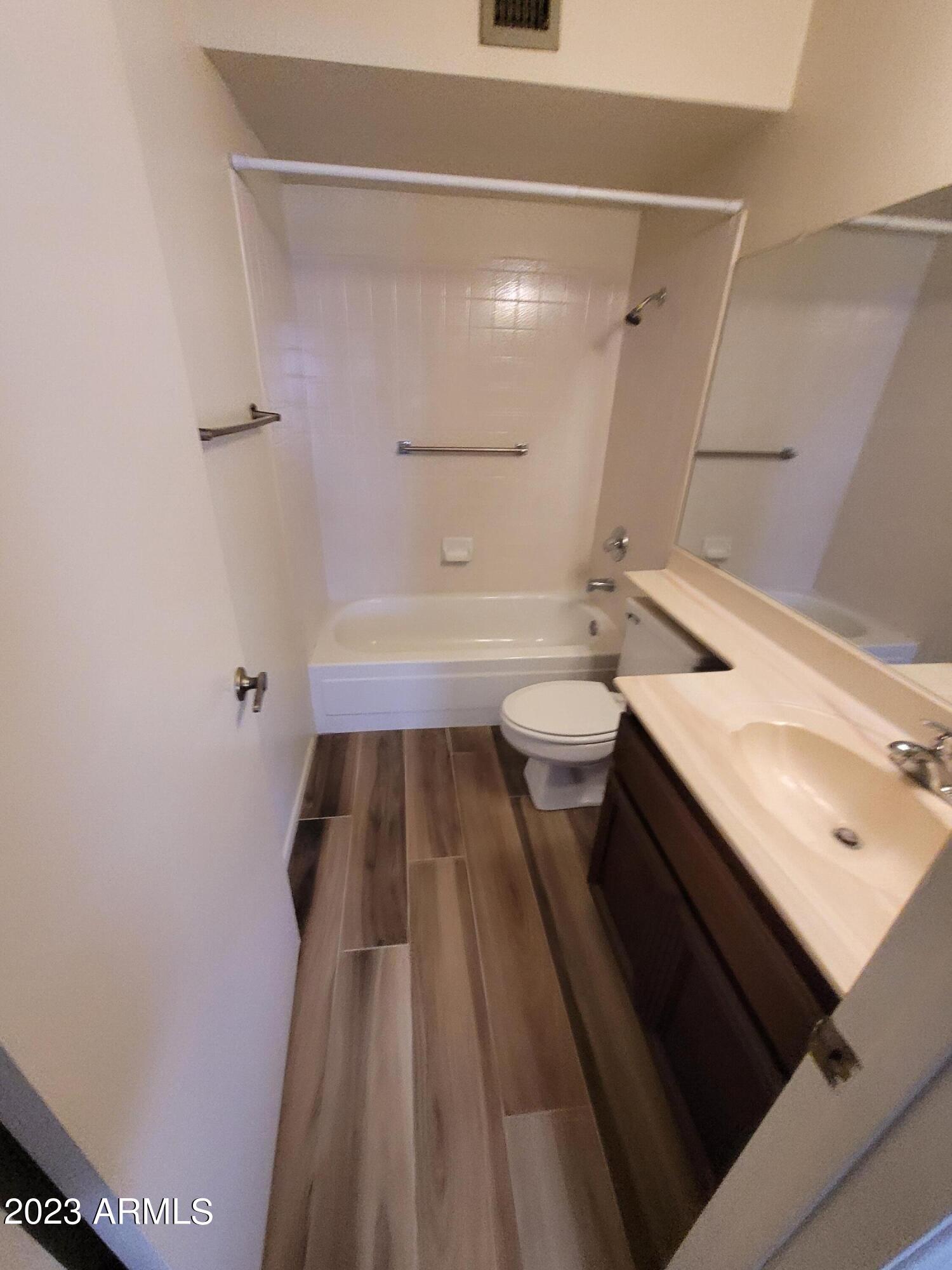 750 East Michelle Drive Phoenix, AZ 85022 - Photo 7 of 7 a bathroom with a sink a toilet a shower and a mirror