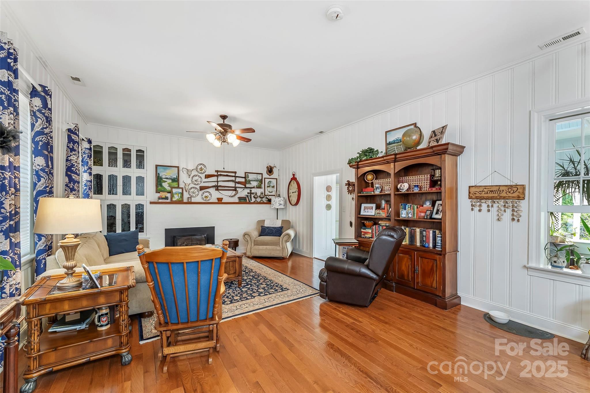 958 Highway 18 Morganton, NC 28655 - Photo 11 of 44 a living room with furniture a rug and a bookshelf