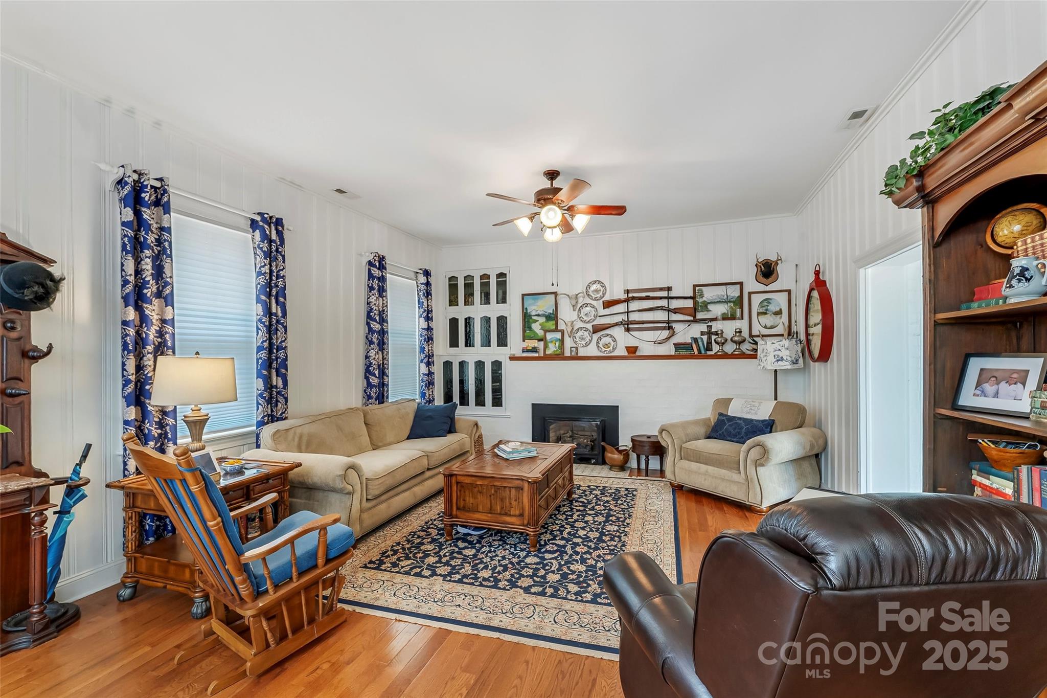 958 Highway 18 Morganton, NC 28655 - Photo 12 of 44 a living room with furniture and a book shelf