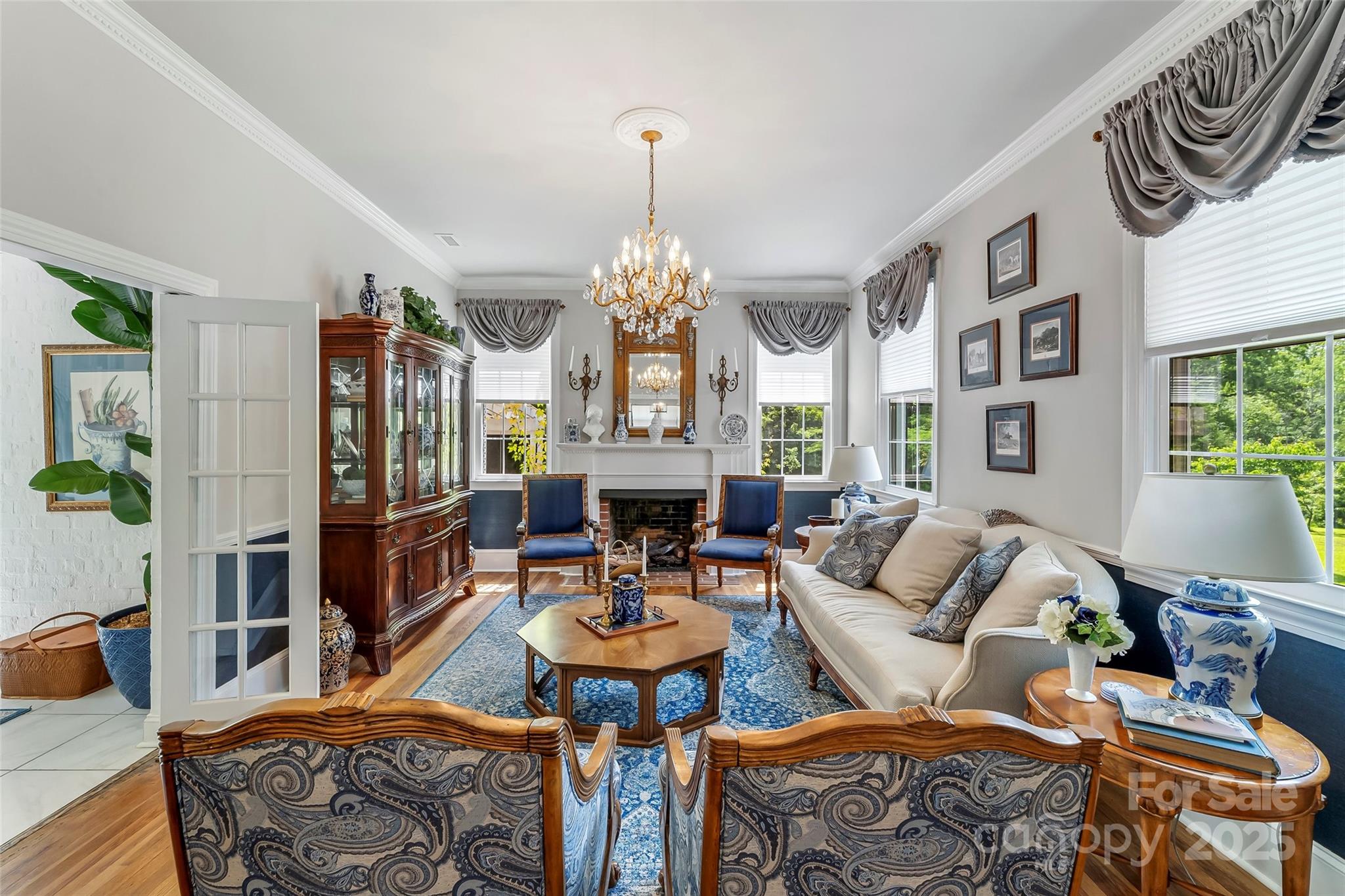 958 Highway 18 Morganton, NC 28655 - Photo 15 of 44 a living room with fireplace furniture and a chandelier