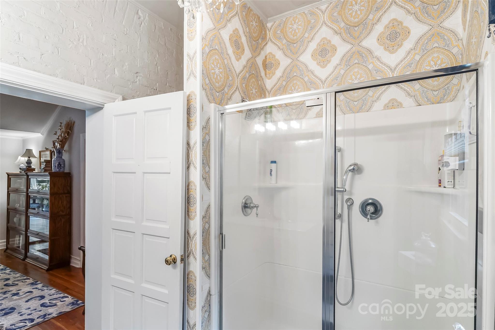 958 Highway 18 Morganton, NC 28655 - Photo 21 of 44 a bathroom with a glass shower door